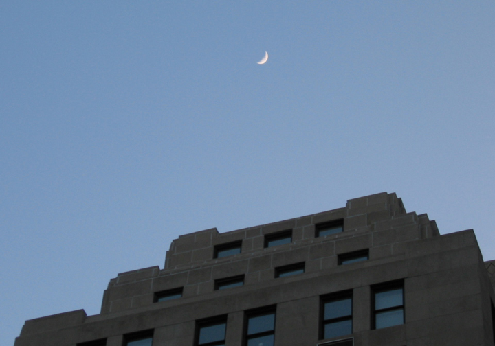 Moon over a downtown building in DC