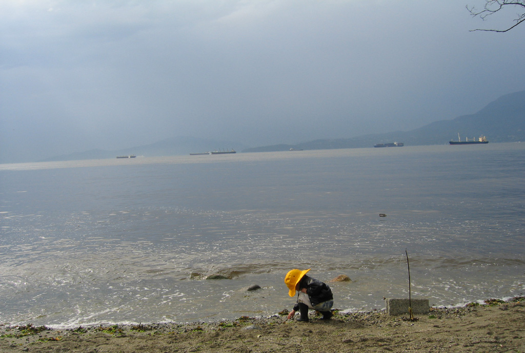 boy in yellow hat on the beach