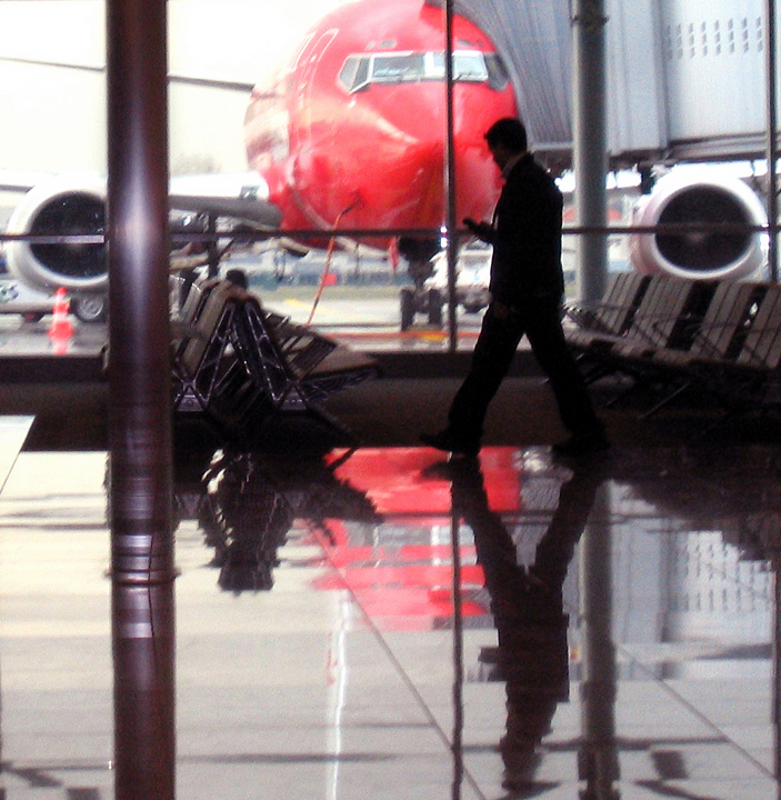 Brussels Airport interior with plane and man