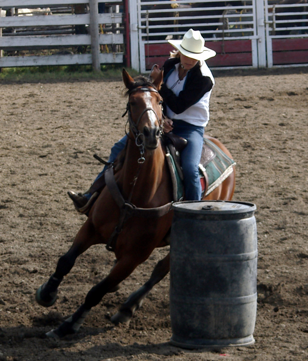 Cowgirl riding the barrels
