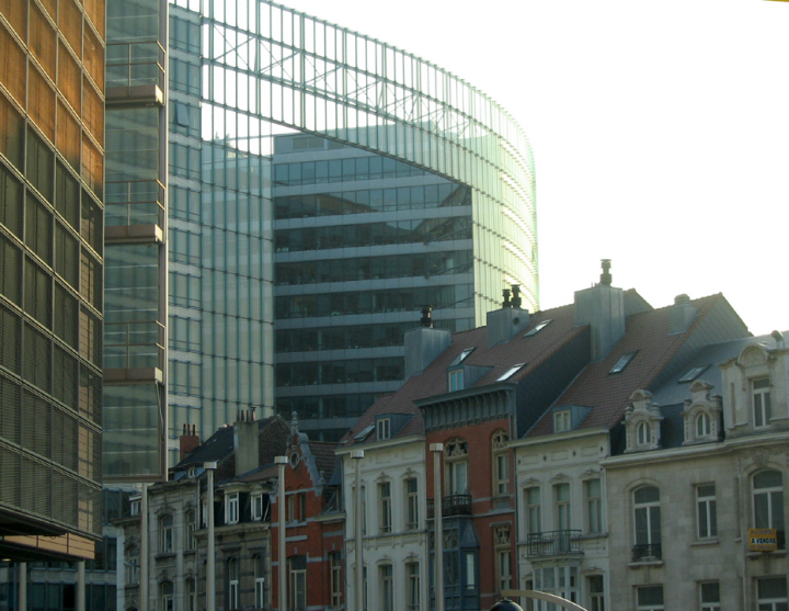 Big EU buildings loom over older houses in Brussels