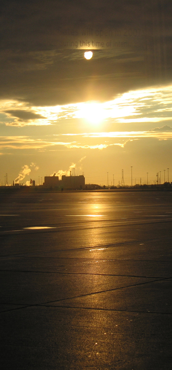 Sunrise reflecting off the airfield, Toronto, with enigma
