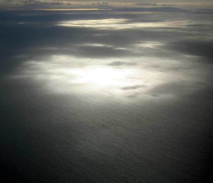 Sun reflected at a large scale on the Pacific ocean near Vancouver