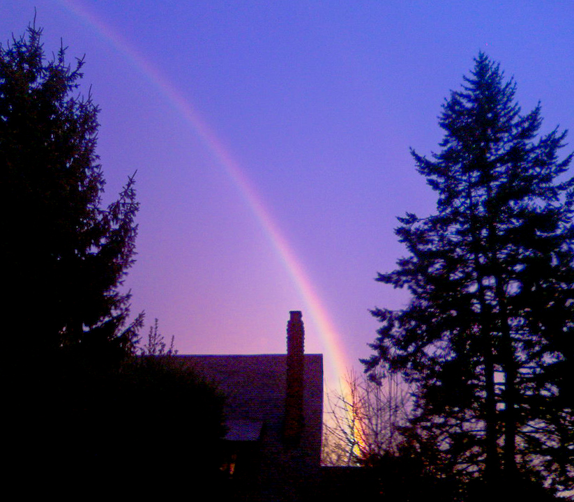 Rainbow in rainy winter dusk
