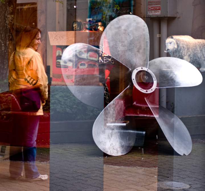 Complex photo of reflections from and view through a plate-glass window on Granville Island in Vancouver