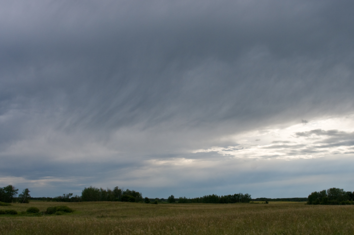 August afternoon sunset on a Saskatchewan farm