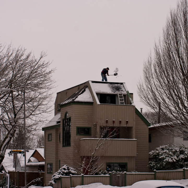 Shoveling snow off a rooftop, Vancouver, January 2009