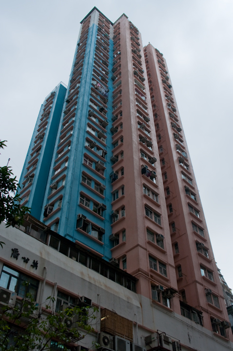Tall skinny decrepit colourful Hong Kong apartment towers