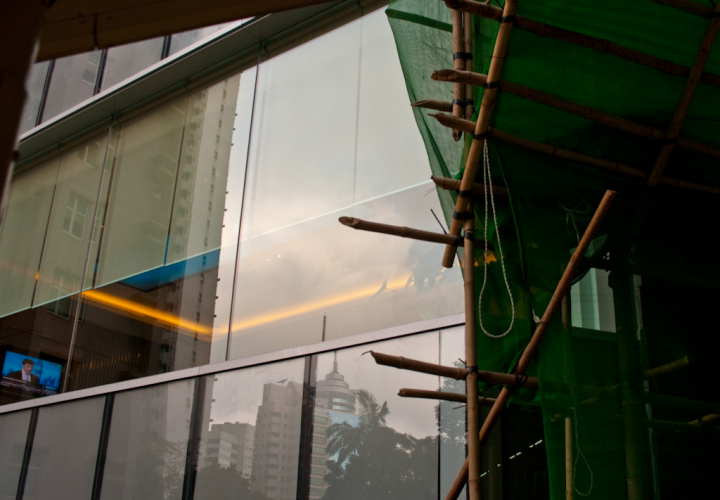Bamboo scaffolding and reflections taken from the Central-Mid-Levels escalators in Hong Kong
