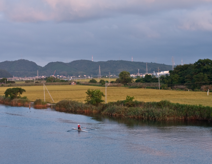 River and rice paddies and kayaker in Matsue