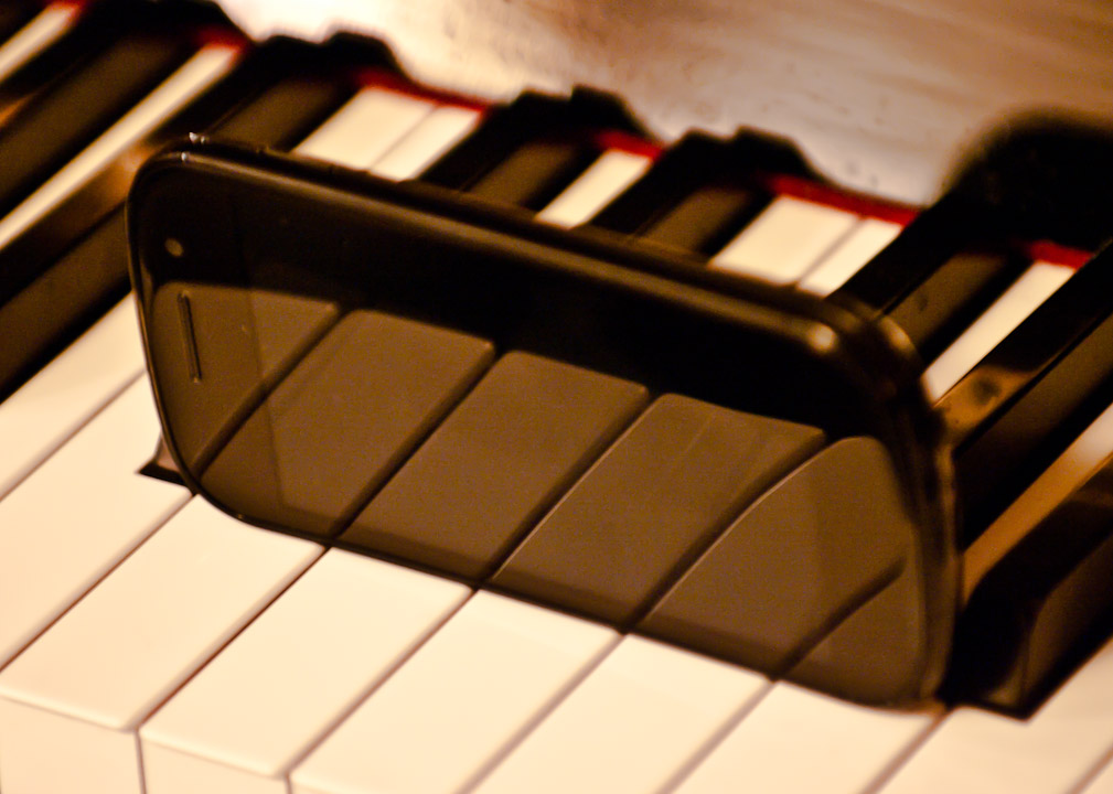 Nexus S phone on piano keyboard