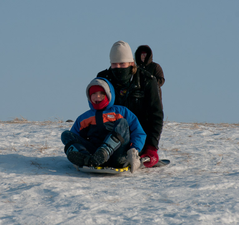 Boys sledding in Regina