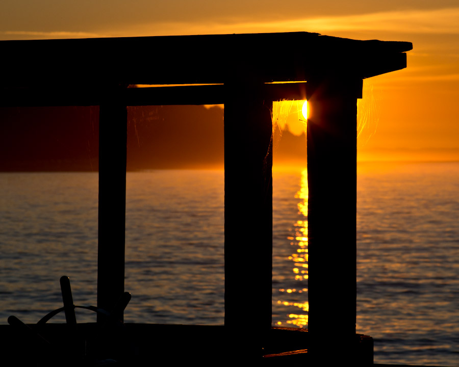 Sunset with posts and cobwebs