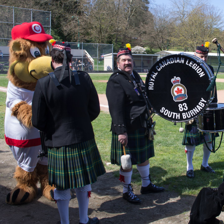 Band and mascot warm up for Opening Day