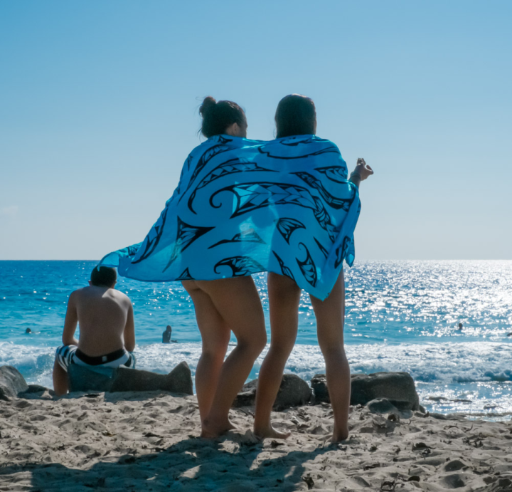 Two women share a sarong
