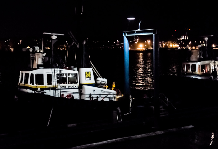 A tugboat by night on the Fraser River in New Westminster