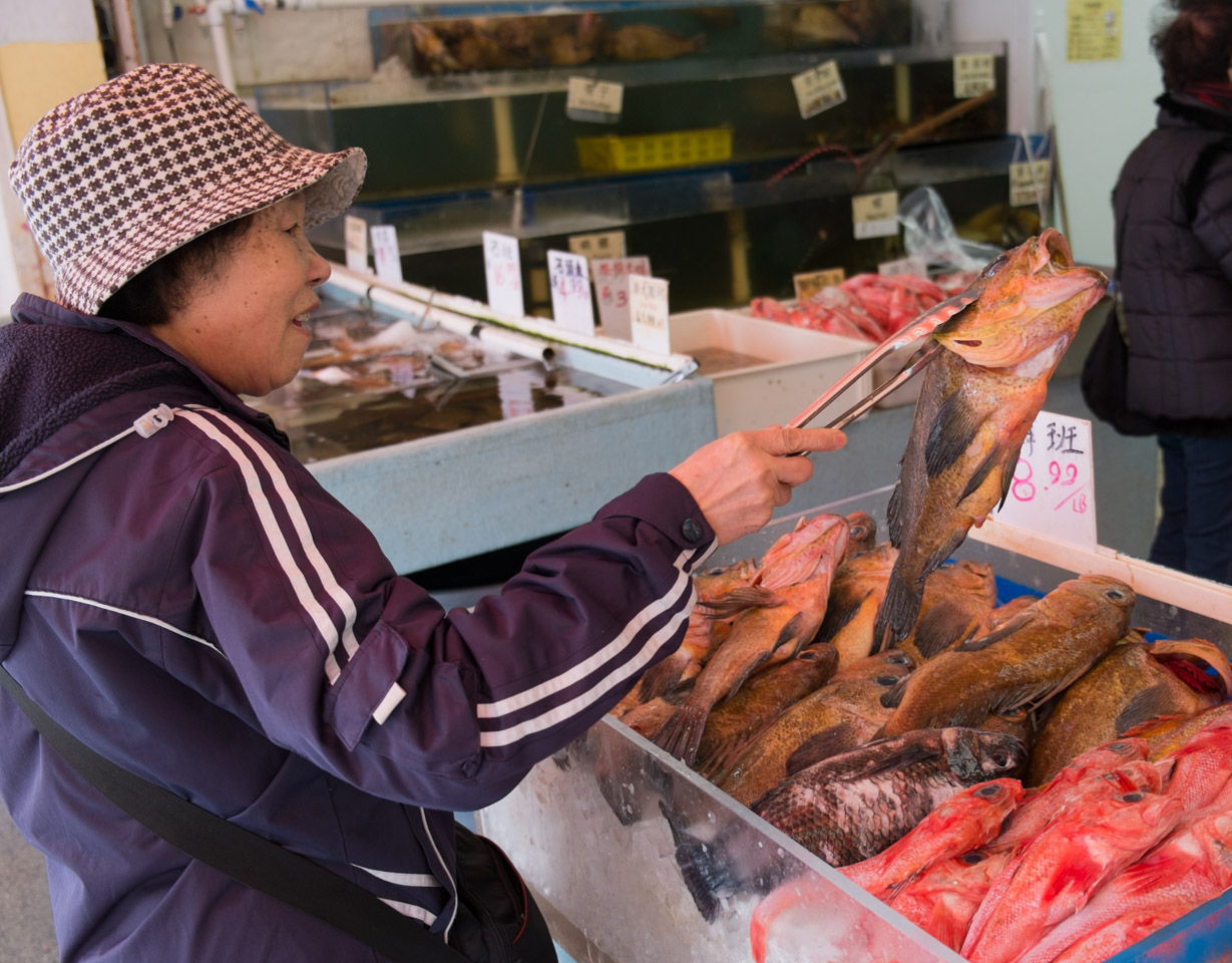 Buying a fish on Gore Street in Vancouver’s Old Chinatown