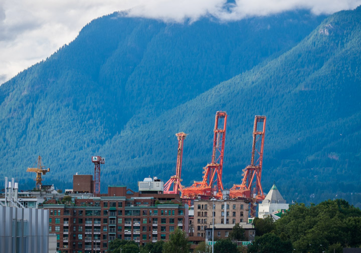 Vancouver harbour cranes and North Shore mountains