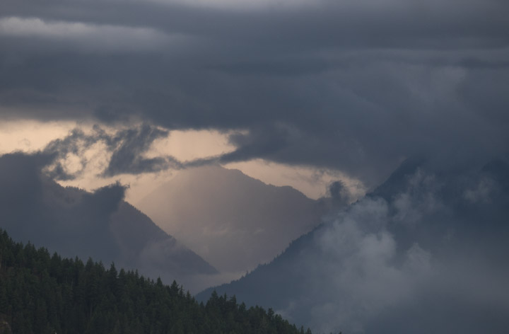 Sun on cloudy mountains