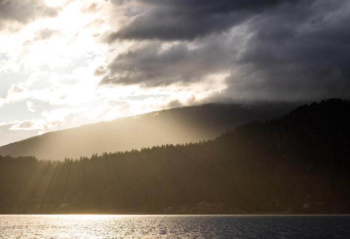 Sun streaming over mountains