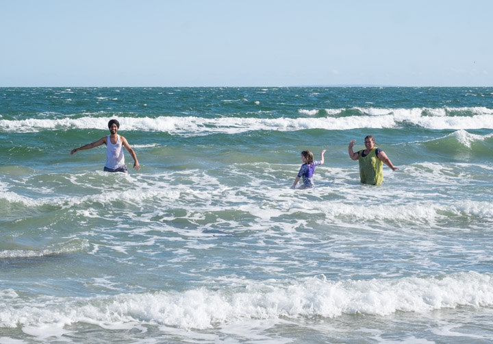 People playing in the waves