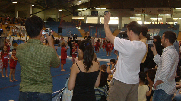 Crowd and performers at gymnastics recital