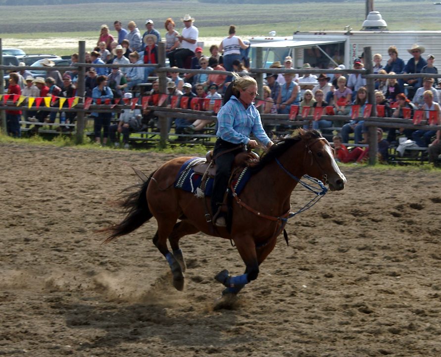 Cowgirl riding the barrels