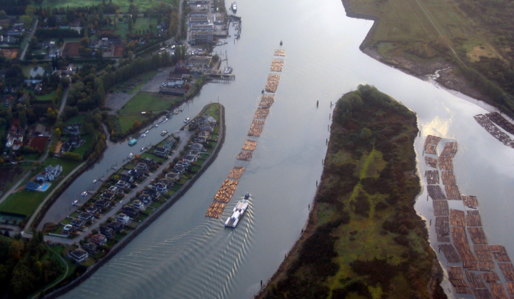 Lumber being towed up the Fraser River, Vancouver