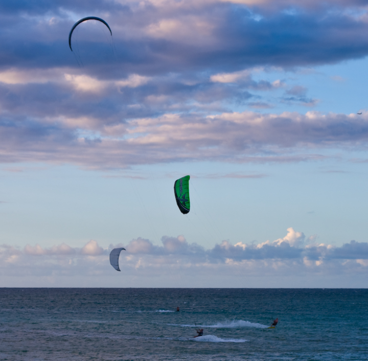 surfers with sails near Kahului, Maui