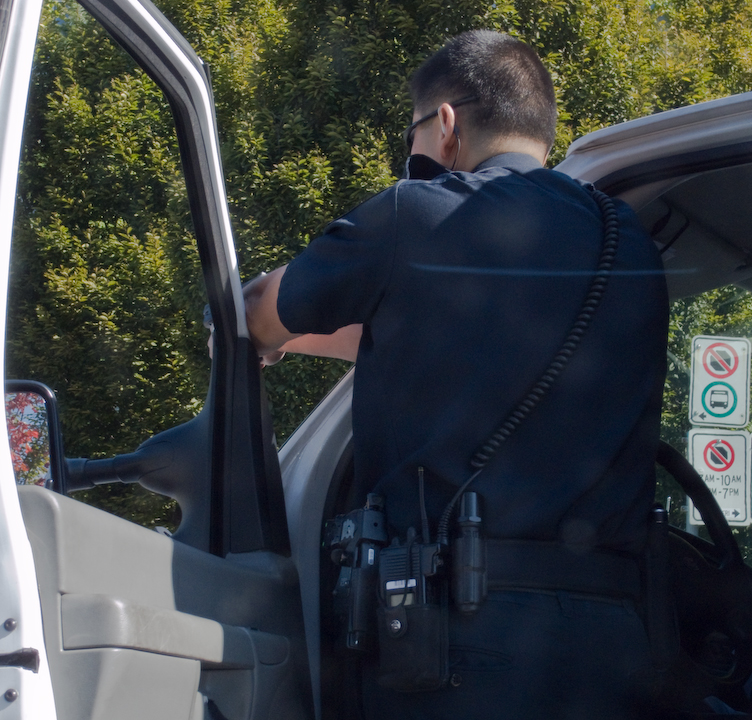 Vancouver policeman aiming his gun