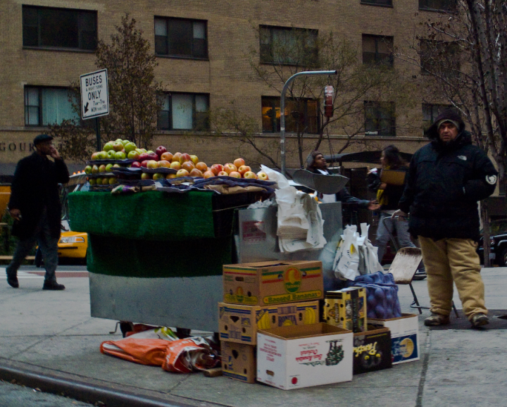 Grumpy fruit vendor in lower Manhattan