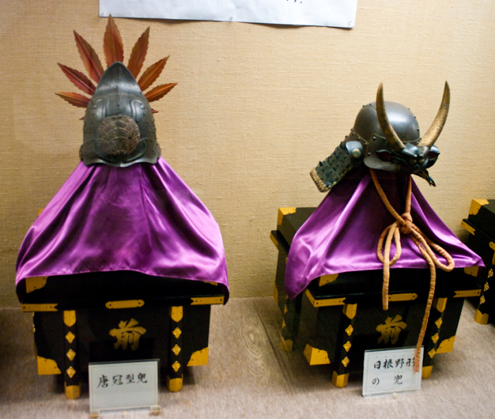 Samurai helmets on display inside the keep of Matsue castle
