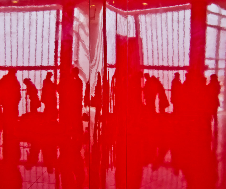 Orchestra reflected in a red wall at the ferry terminal at Colonia Del Salvador