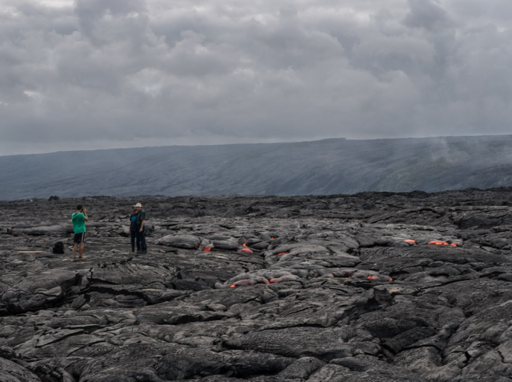 Being photographed in front of a live lava flow