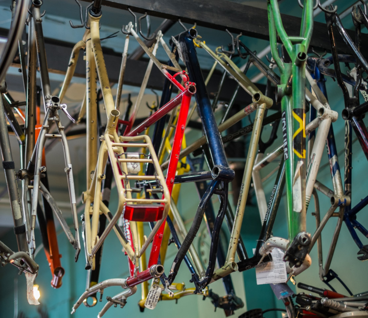 Hanging bicycle frames at Vancouver’s Our Community Bikes