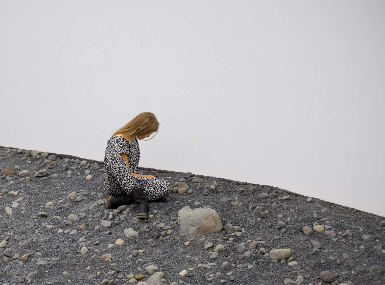 A young woman enjoys Riverbed by Olafur Eliasson