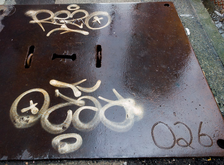 Graffiti on wet metal