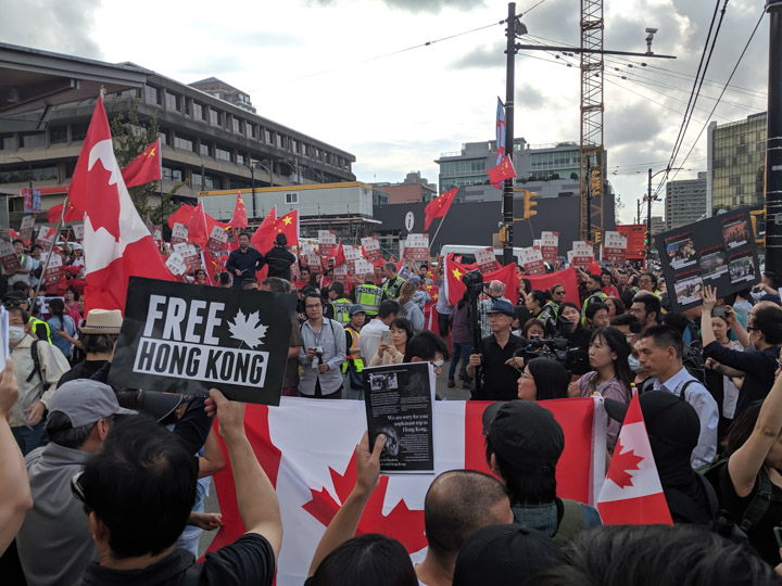 Pro-Beijing demonstrators in expensive cars