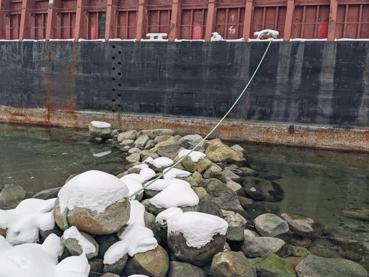 Barge tied up to a rock on the Vancouver waterfront