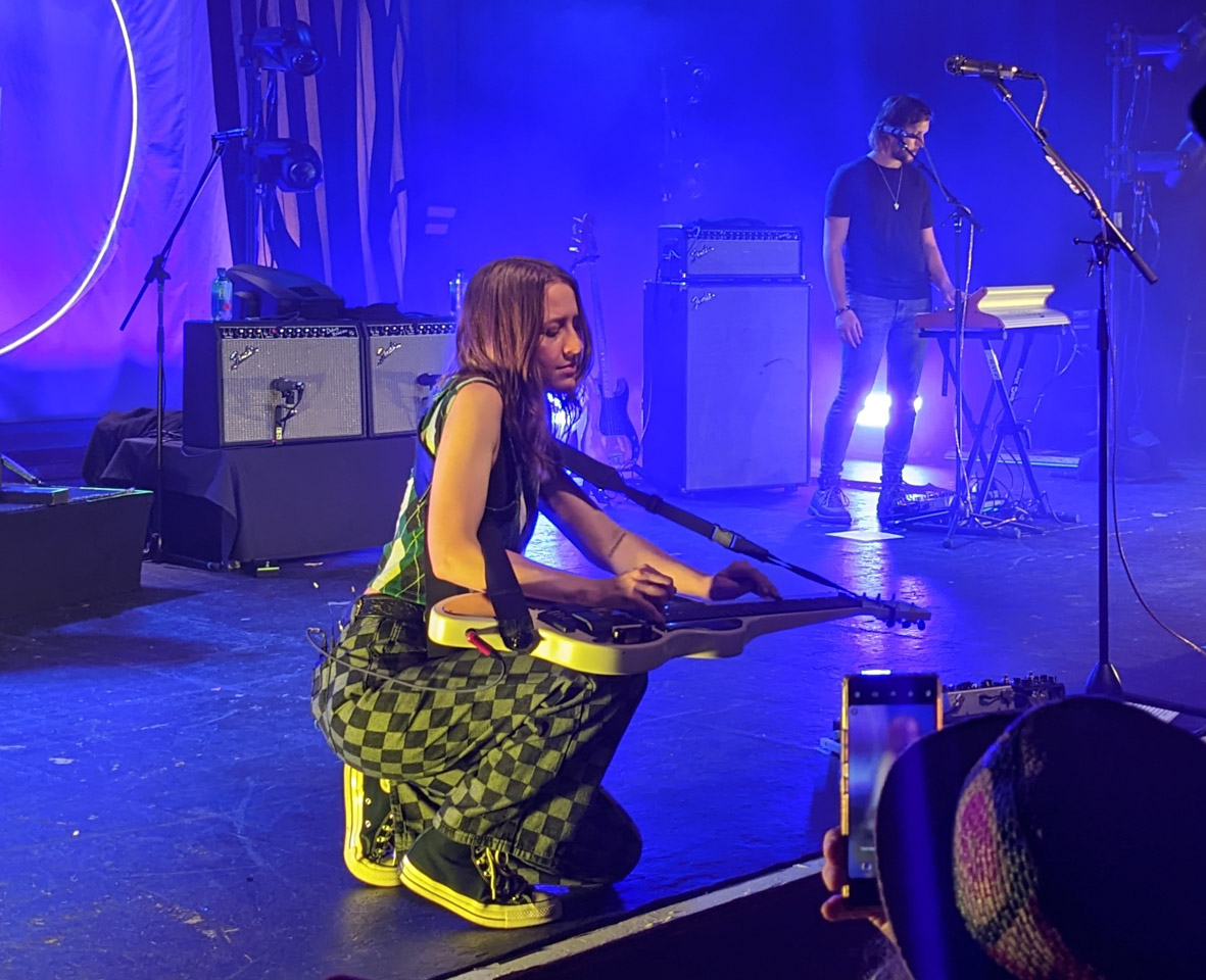 Megan Lovell of Larkin Poe taking a slide-guitar solo