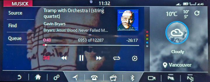 Jaguar infotainment showing current music and weather
