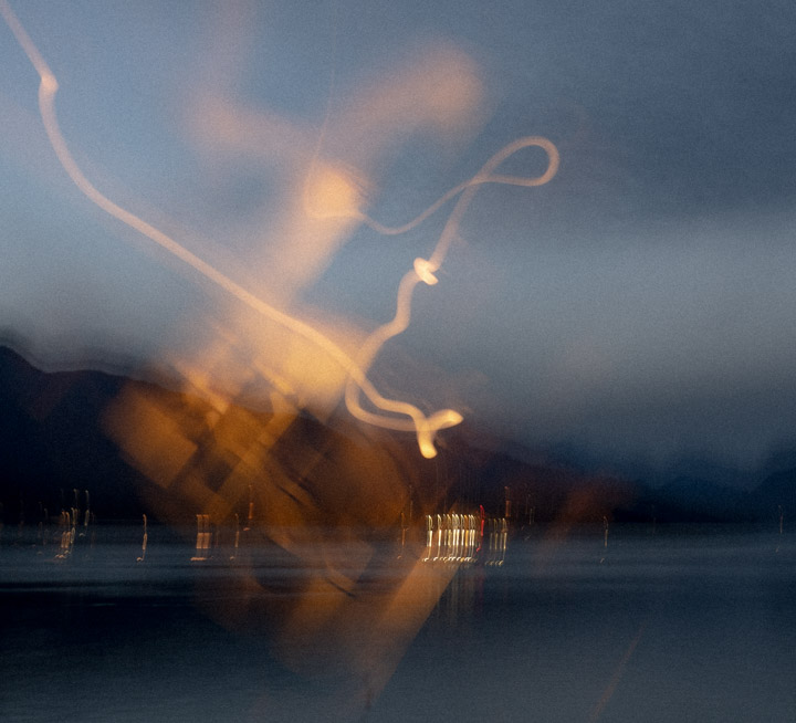 A dark picture full of vague swirls and jiggly lights