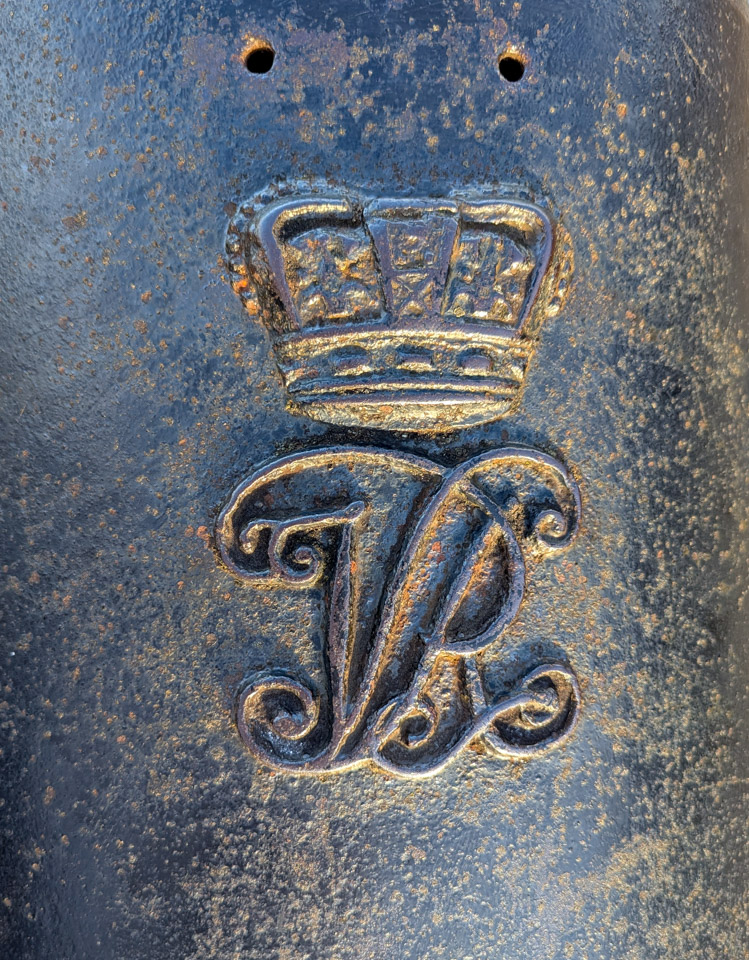 Engraving on metal: Crown and “VR”