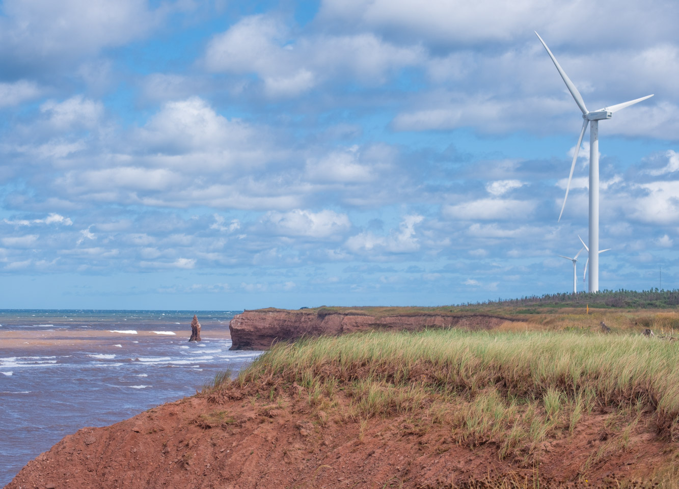 red and blue see, red soil, wind turbines