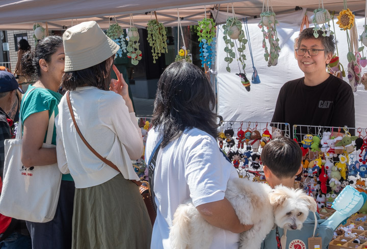 Selling trinkets at the street fair